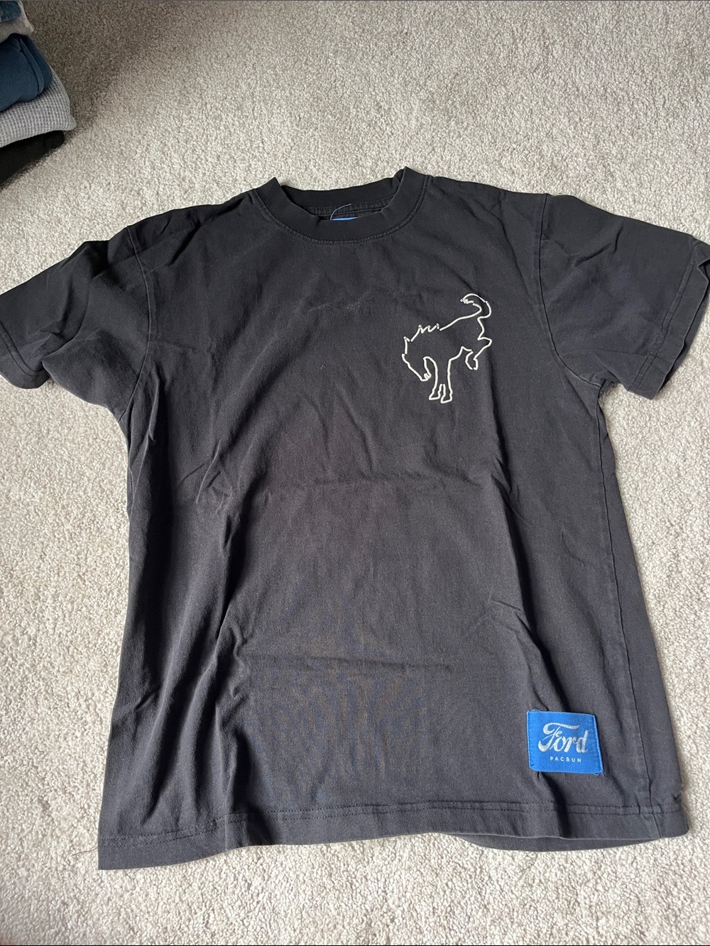 PacSun Black Short Sleeve Tee with White Bronco Outline and Blue Patch